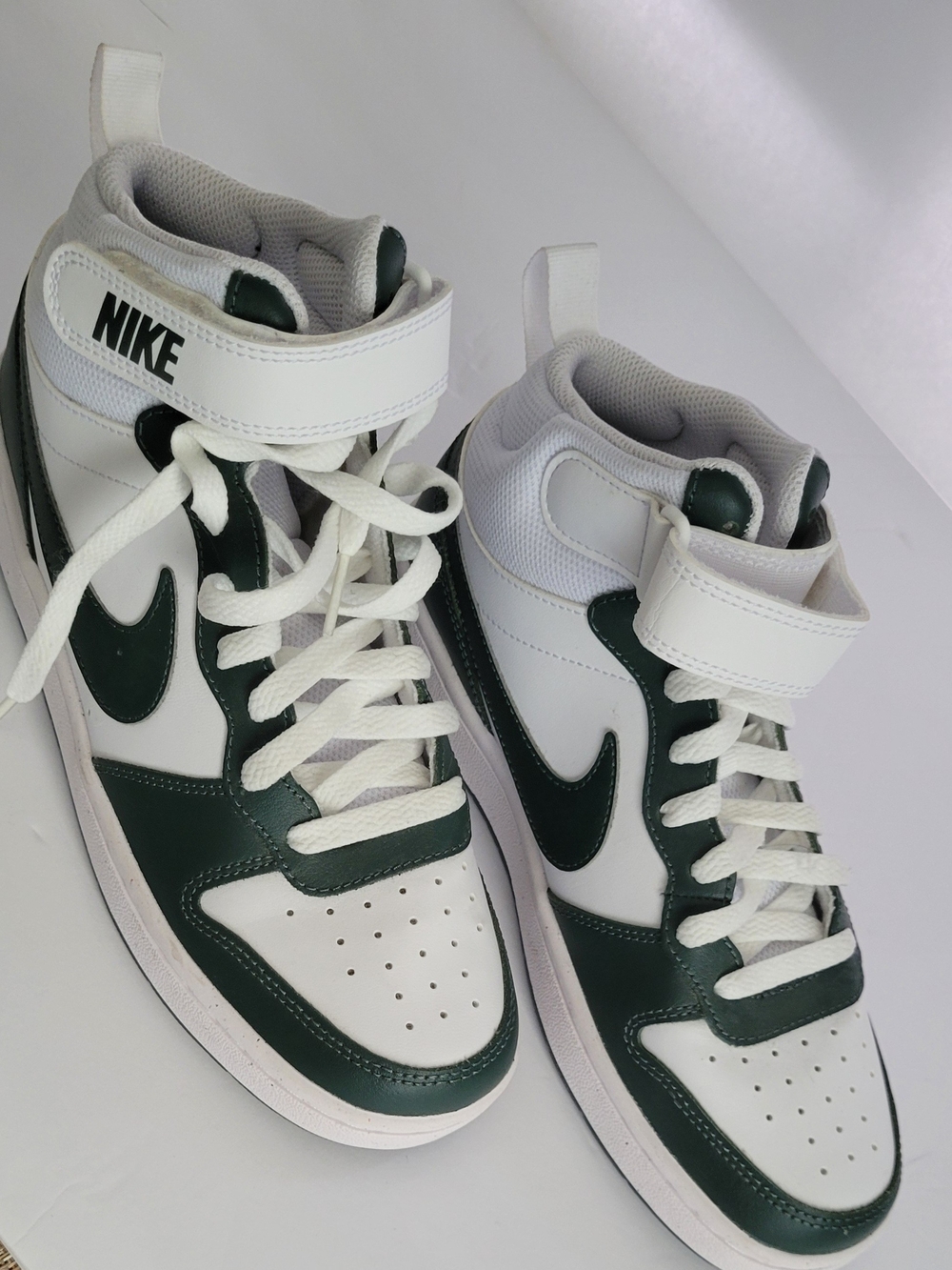 Nike- Court Borough Mid 2 sneakers in a white and vintage green colorway.